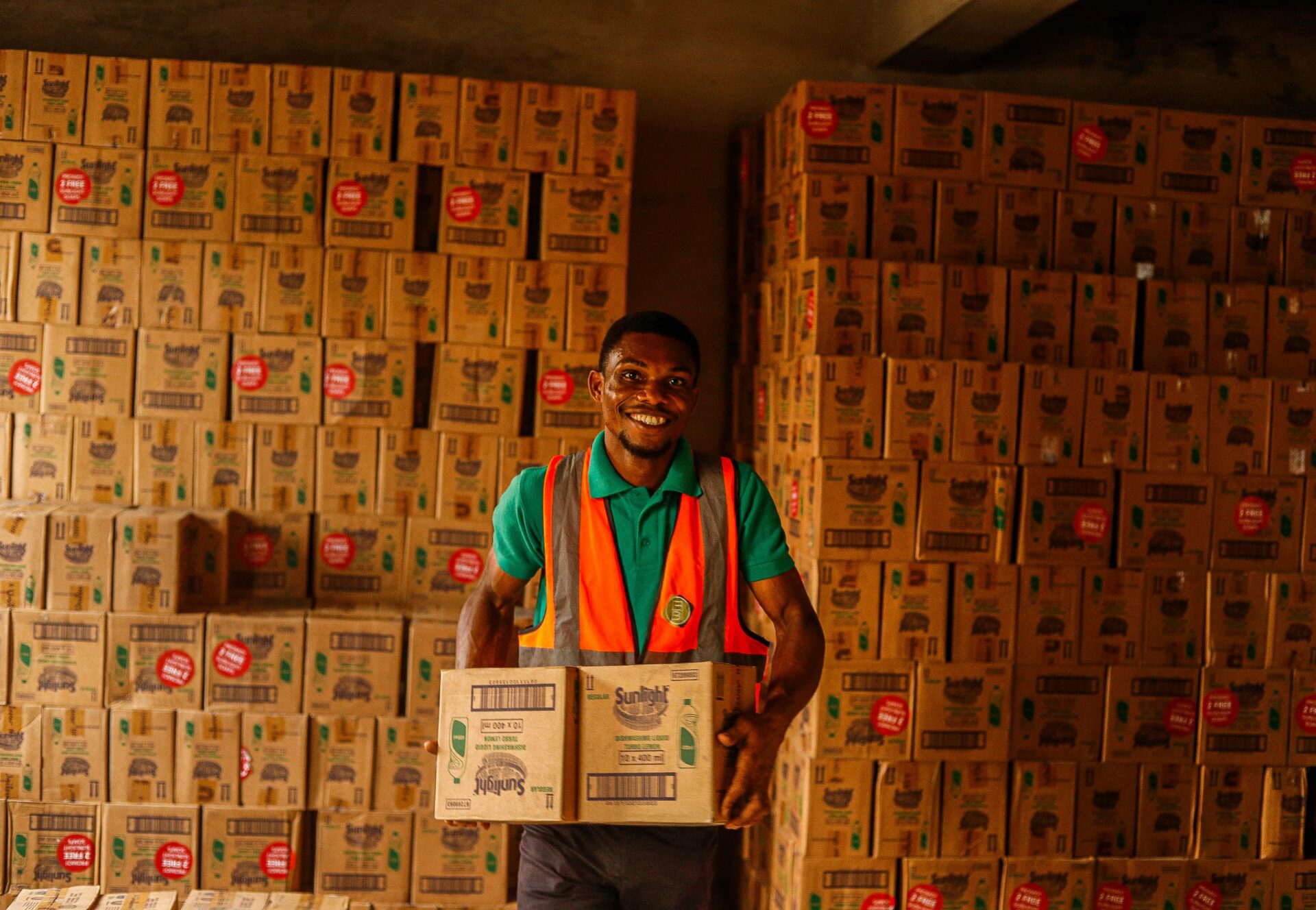 Smiling man in a warehouse